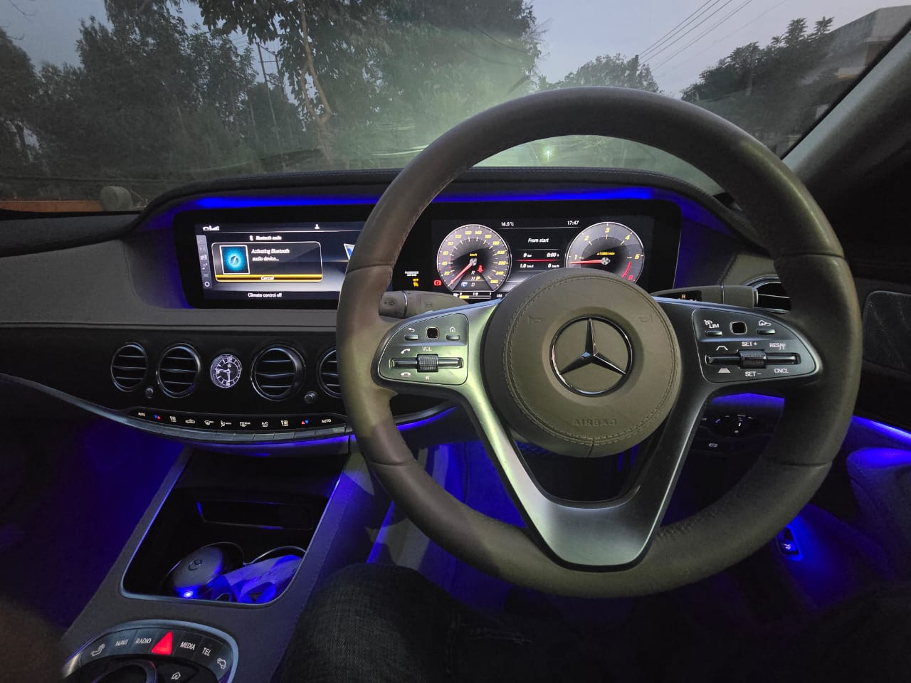 Steering wheel and instrument cluster with blue ambient lighting
