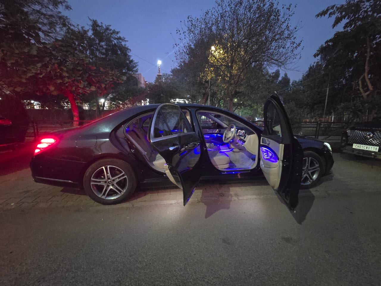 Black Mercedes-Benz S-Class parked on a quiet road